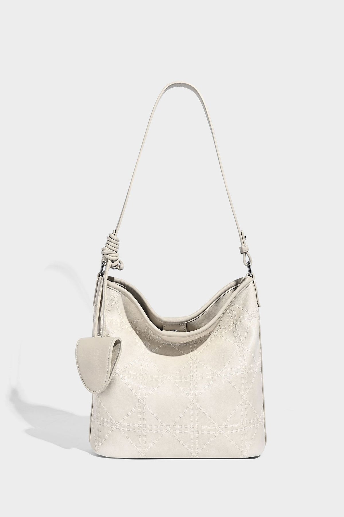Diamond-quilted leather-look bucket shoulder bag with knotted strap accent and attached mini pouch, detail view 20