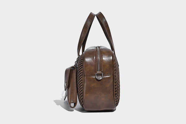 Structured woven-texture front top-handle handbag with zip closure, dual handles, detachable shoulder strap, and matching