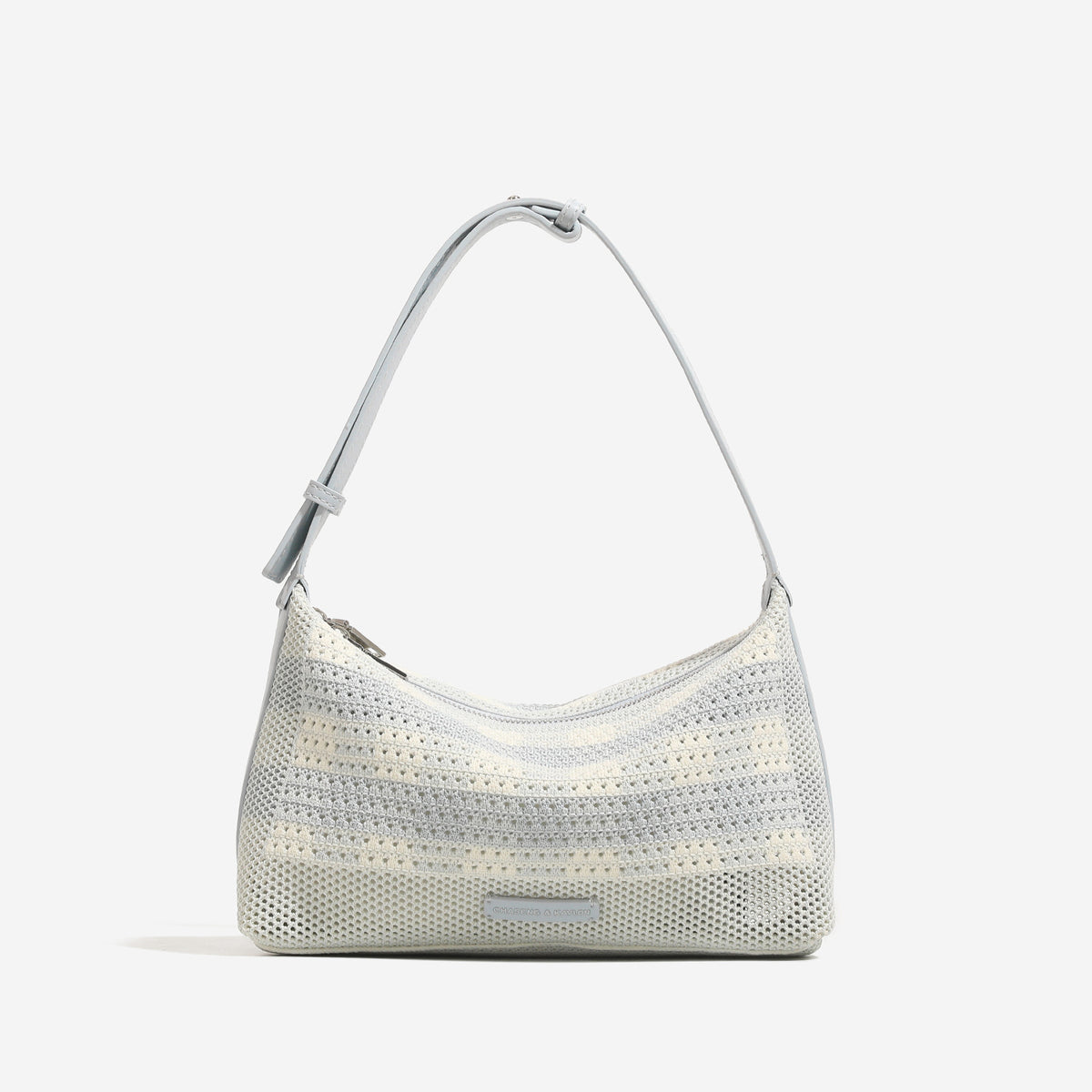 Woven crescent hobo shoulder bag with adjustable leather-look strap and top zip closure, detail view 6