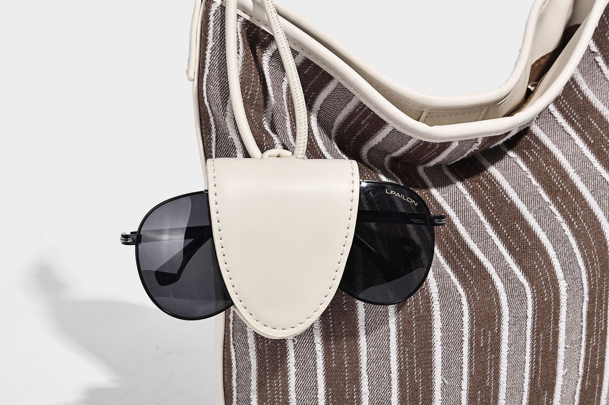 Large striped canvas hobo shoulder bag with cream trim and silver-tone hardware, detail view 18