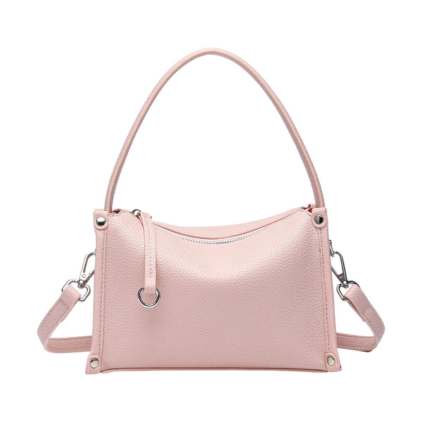 Small structured pebbled-finish convertible bag with silver corner studs, zip top, and detachable shoulder strap, detail view