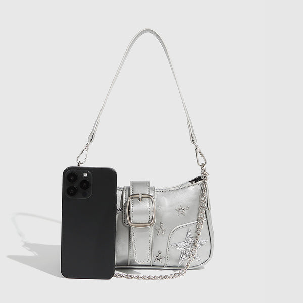 Compact metallic silver shoulder bag with glitter star appliqués, rhinestone star charms, front belt buckle strap, chunky