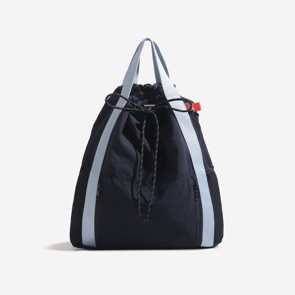 Soft matte drawstring backpack tote with braided cord closure, front zip pocket, and mesh side panels, detail view 7