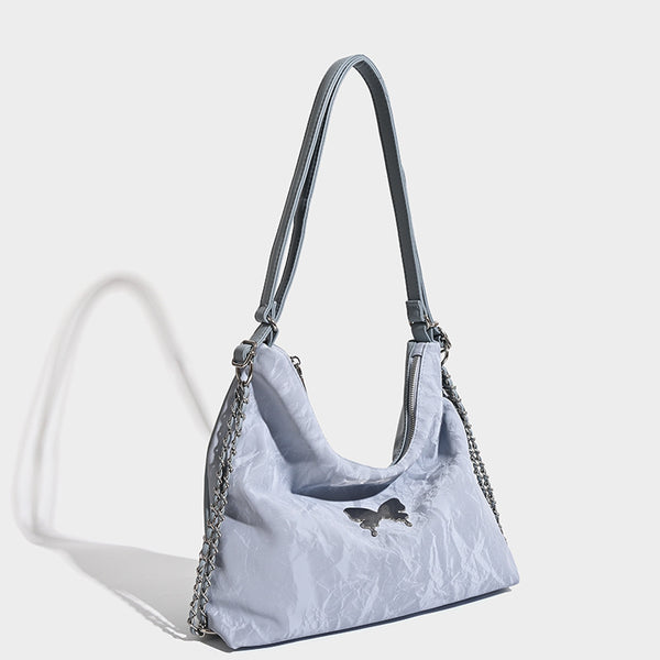 Crinkle-finish hobo shoulder bag with silver-tone chain side panels and butterfly embellishment, detail view 2