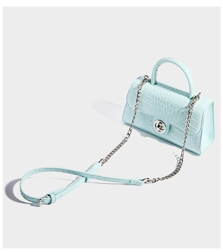 Mini croc-embossed glossy structured handbag with silver-tone turn-lock clasp and short top handle, detail view 11