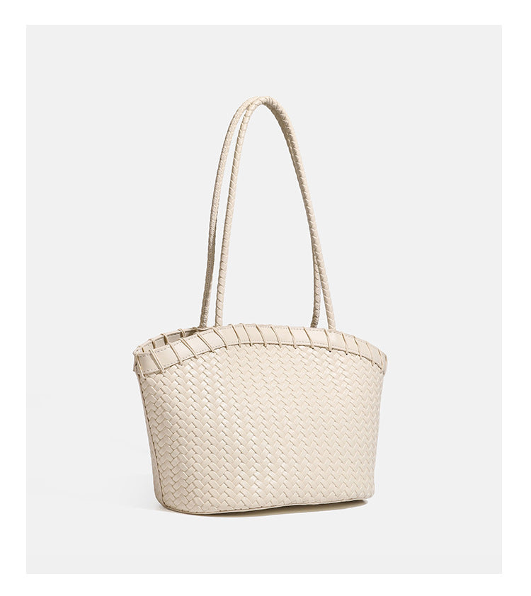 Chartreusegrüne Tote-Bag aus Korbgeflecht mit langen geflochtenen Schulterriemen, verstärktem Rand und passender Reißverschlusstasche, Detailansicht