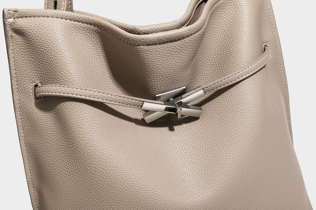 Pebbled leather-look tote bag with front toggle hardware and long shoulder strap, detail view 20