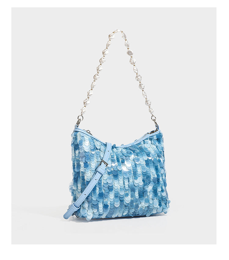 Champagne and ivory large-disc sequin shoulder bag with baroque faux-pearl beaded chain strap and silver-tone zip closure
