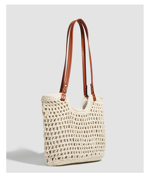Open-knit woven tote bag with leather-look shoulder straps and brass-tone hardware in off-white, detail view 11