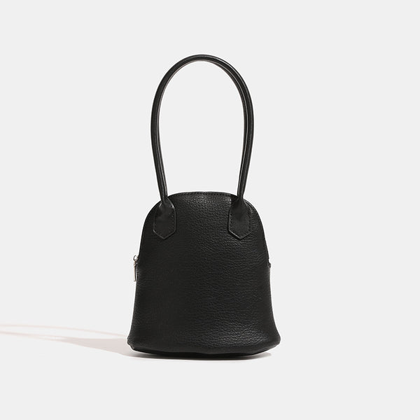 Rounded shell handbag with pebbled leather-look finish, dual top handles, and silver-tone zipper, detail view 8