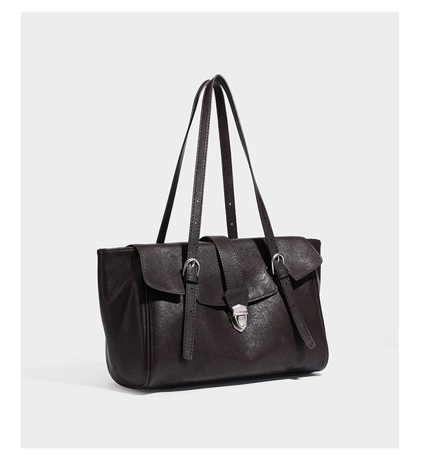 Large structured vintage-style tote bag with flap-front turn-lock closure, twin buckle straps, and double shoulder handles