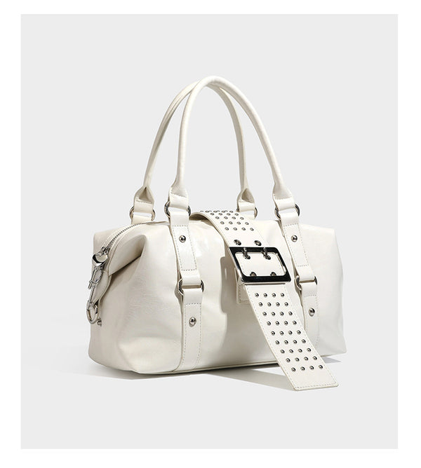 Glossy crinkled barrel handbag with silver stud buckle strap and detachable shoulder strap, detail view 15