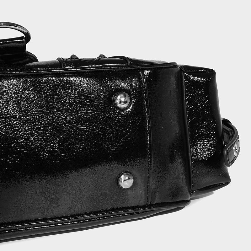 Compact glossy leather-look crossbody bag with silver studs, buckle hardware, and multiple zip pockets, detail view 23