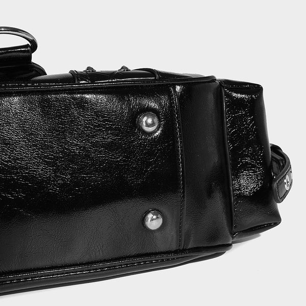 Compact glossy leather-look crossbody bag with silver studs, buckle hardware, and multiple zip pockets, detail view 23