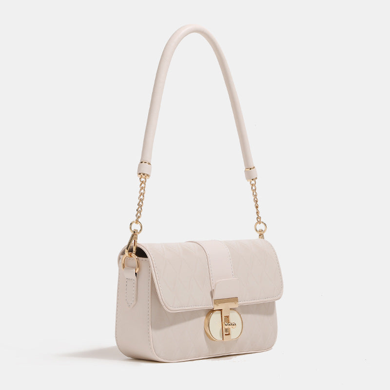 Compact quilted flap crossbody bag with gold turn-lock clasp and adjustable shoulder strap, detail view 3