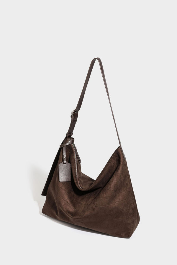 Slouchy hobo shoulder bag in matte croc-embossed leather-look finish with top zip closure and long adjustable strap, detail