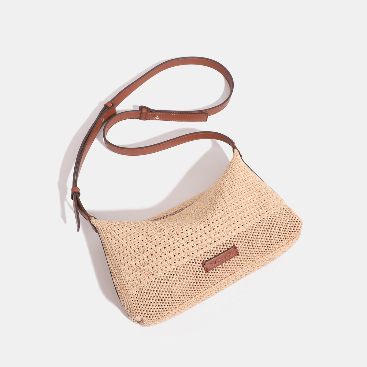 Compact open-weave hobo shoulder bag with zip top, leather-look trim, and adjustable strap, detail view 4