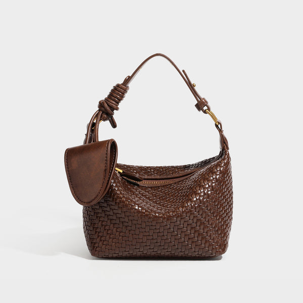 Small glossy basket-weave hobo shoulder bag in brown with knotted top handle, flap accent pocket, and gold-tone hardware