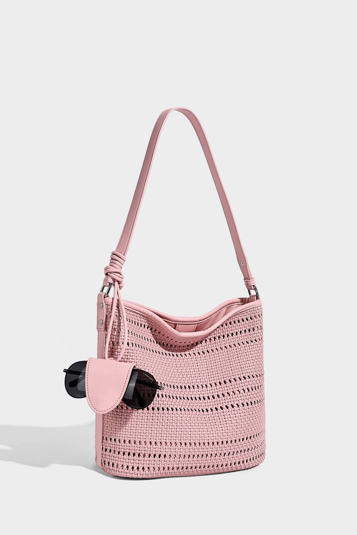 Handwoven open-weave shoulder bag with leather-look trim, knotted adjustable strap, and clip-on sunglasses sleeve pouch