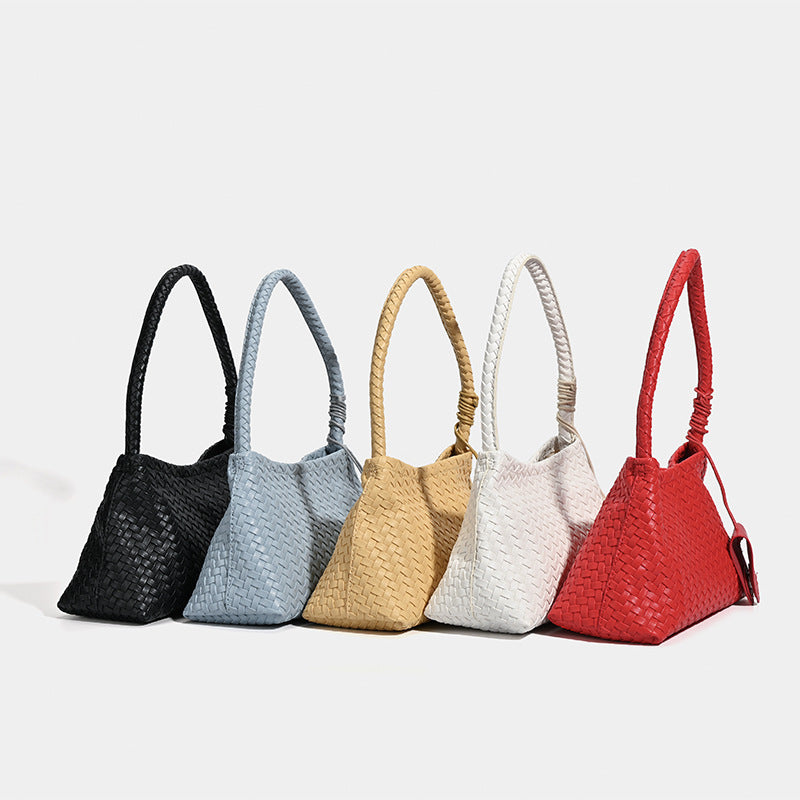 Woven leather-look shoulder bag with braided strap, trapezoidal body, and matching zip pouch, detail view 2