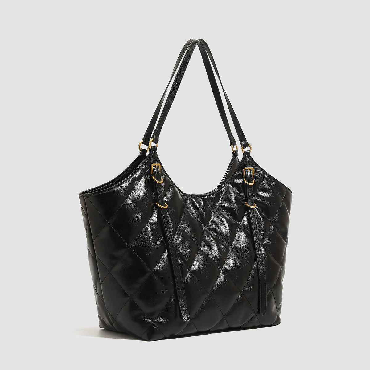 Large quilted diamond-pattern tote bag with glossy leather-look finish, dual flat shoulder straps, and gold-tone hardware