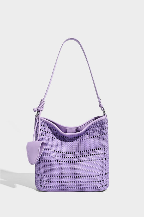 Handwoven open-weave shoulder bag with leather-look trim, knotted adjustable strap, and clip-on sunglasses sleeve pouch