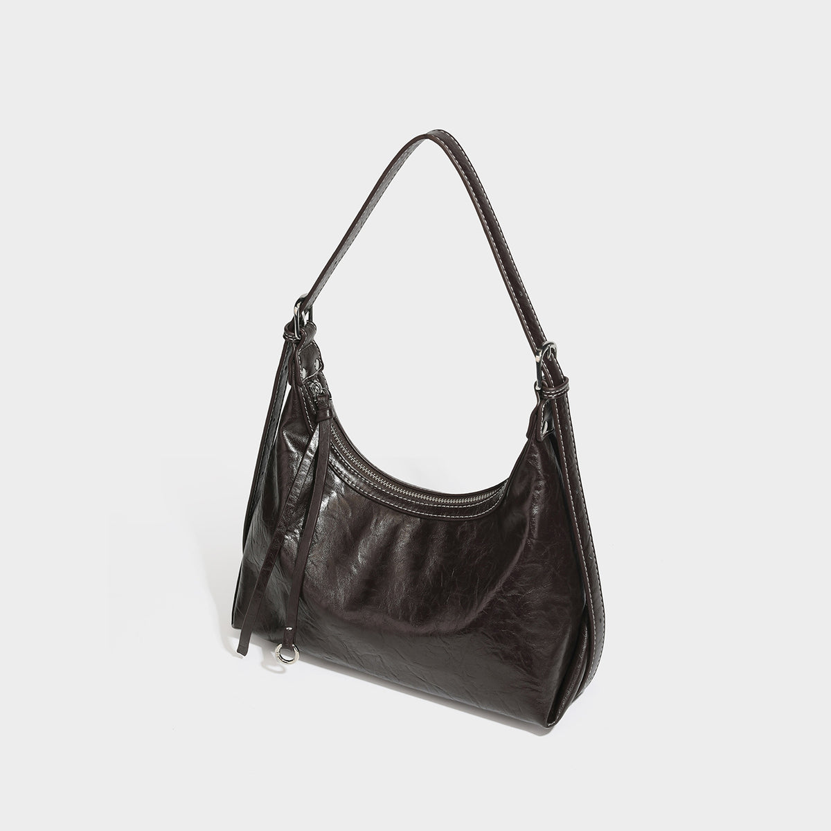 Slouchy hobo shoulder bag in glossy crinkled leather-look finish with zip-top closure and silver-tone ring hardware, front
