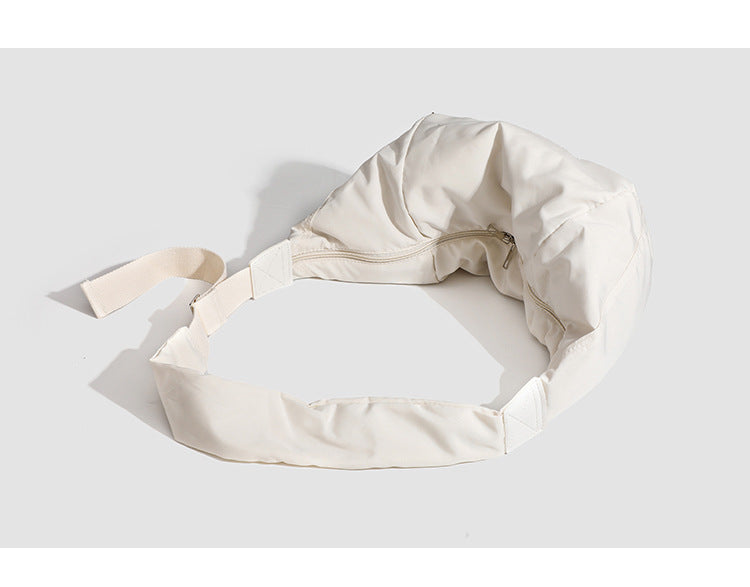 Large crescent sling shoulder bag in gathered fabric with zip closure and adjustable strap, detail view 8