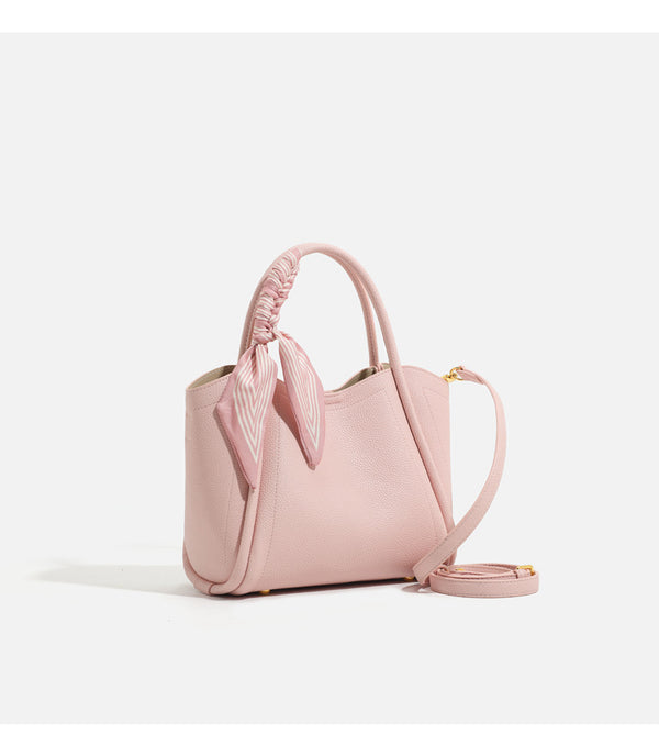 Pebbled leather-look bucket tote bag with scarf-wrapped top handle and gold-tone hardware, detail view 10