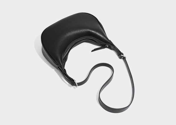 Crescent half-moon shoulder bag in pebbled leather-look finish with adjustable strap and silver-tone hardware, detail view 27