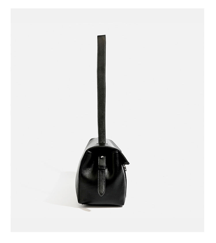 Structured rectangular flap shoulder bag with smooth leather-look finish, silver-tone turn-lock clasp, and long slim
