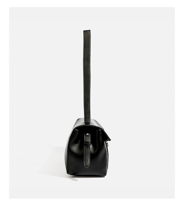 Structured rectangular flap shoulder bag with smooth leather-look finish, silver-tone turn-lock clasp, and long slim