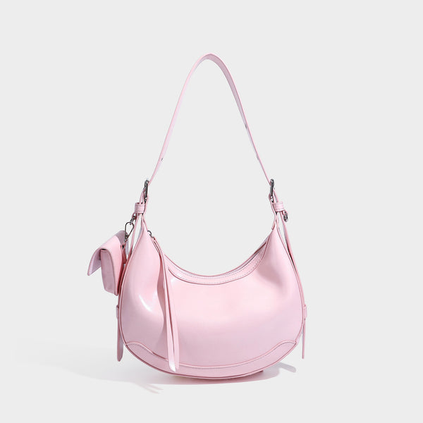 Glossy leather-look crescent hobo shoulder bag with dark contrast trim, silver-tone hardware, and attached mini flap pouch