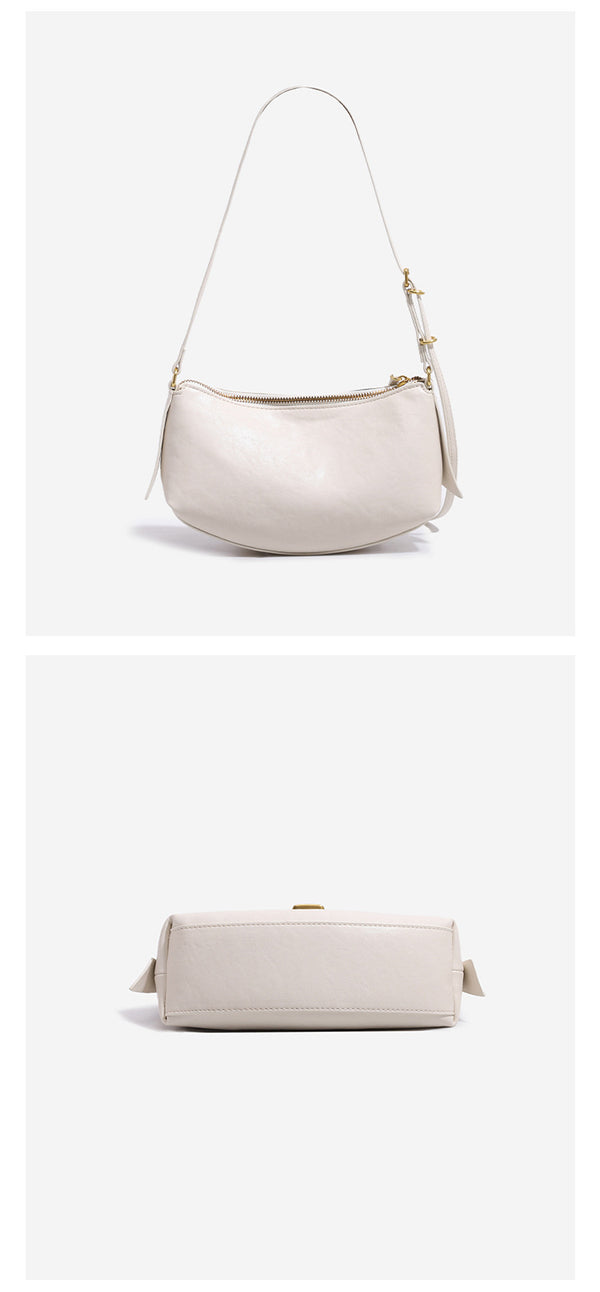 Compact soft rounded zip-top shoulder bag with gold-tone hardware and adjustable crossbody strap, detail view 15