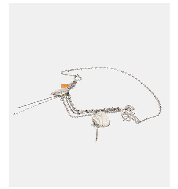 Slouchy lace-texture bucket bag with silver-tone chain strap, draped chain hardware, and shell charms, detail view 13