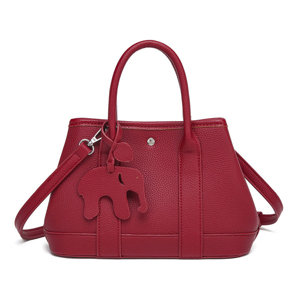 Structured pebbled leather-look top-handle tote bag with elephant charm and detachable shoulder strap, detail view 9