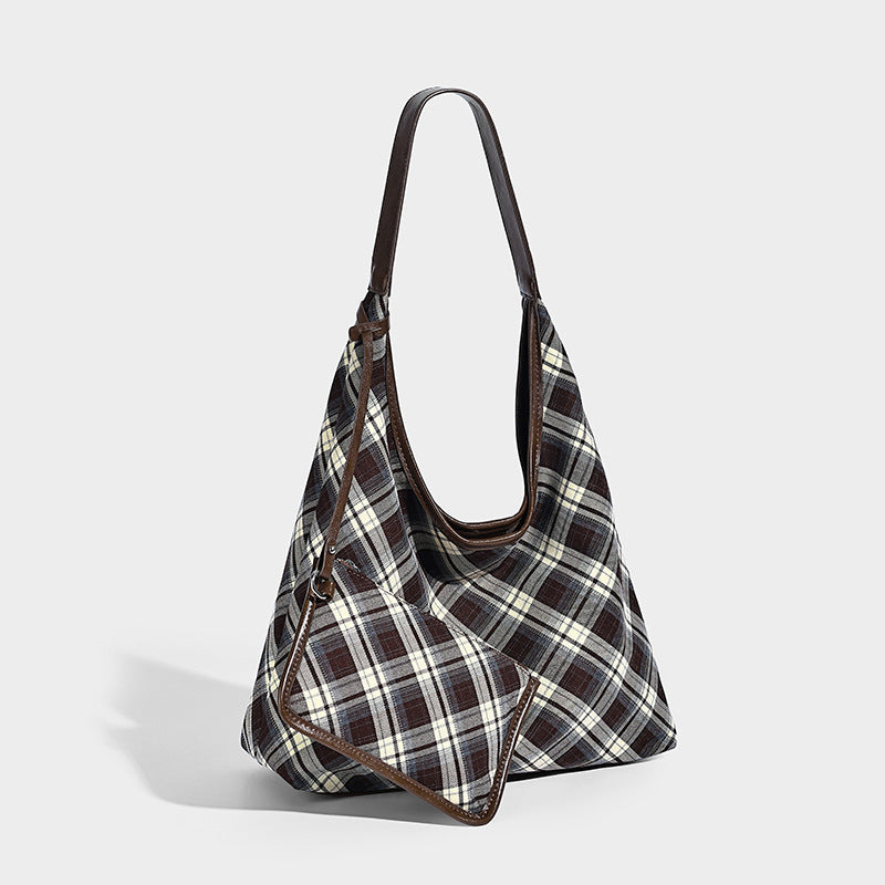 Slouchy hobo shoulder bag in dark brown, cream, and gray plaid with deep brown leather-look trim and single long shoulder