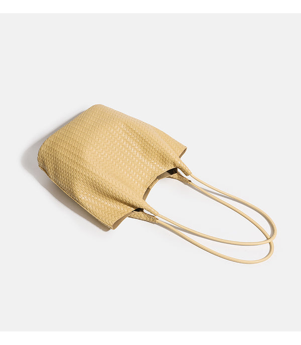 Large woven textured tote bag with long shoulder straps and structured rectangular base, detail view 9