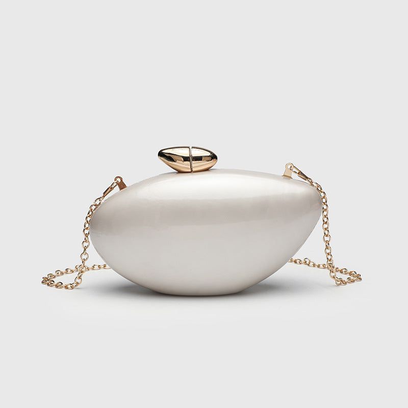 Oval hard-shell marbled gloss clutch bag with gold-tone kiss-lock clasp and detachable gold chain strap, detail view 9