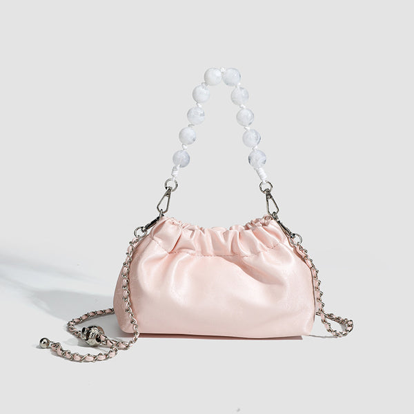 Small ruched drawstring pouch bag with pearl-bead handle and silver-tone chain strap, detail view 6