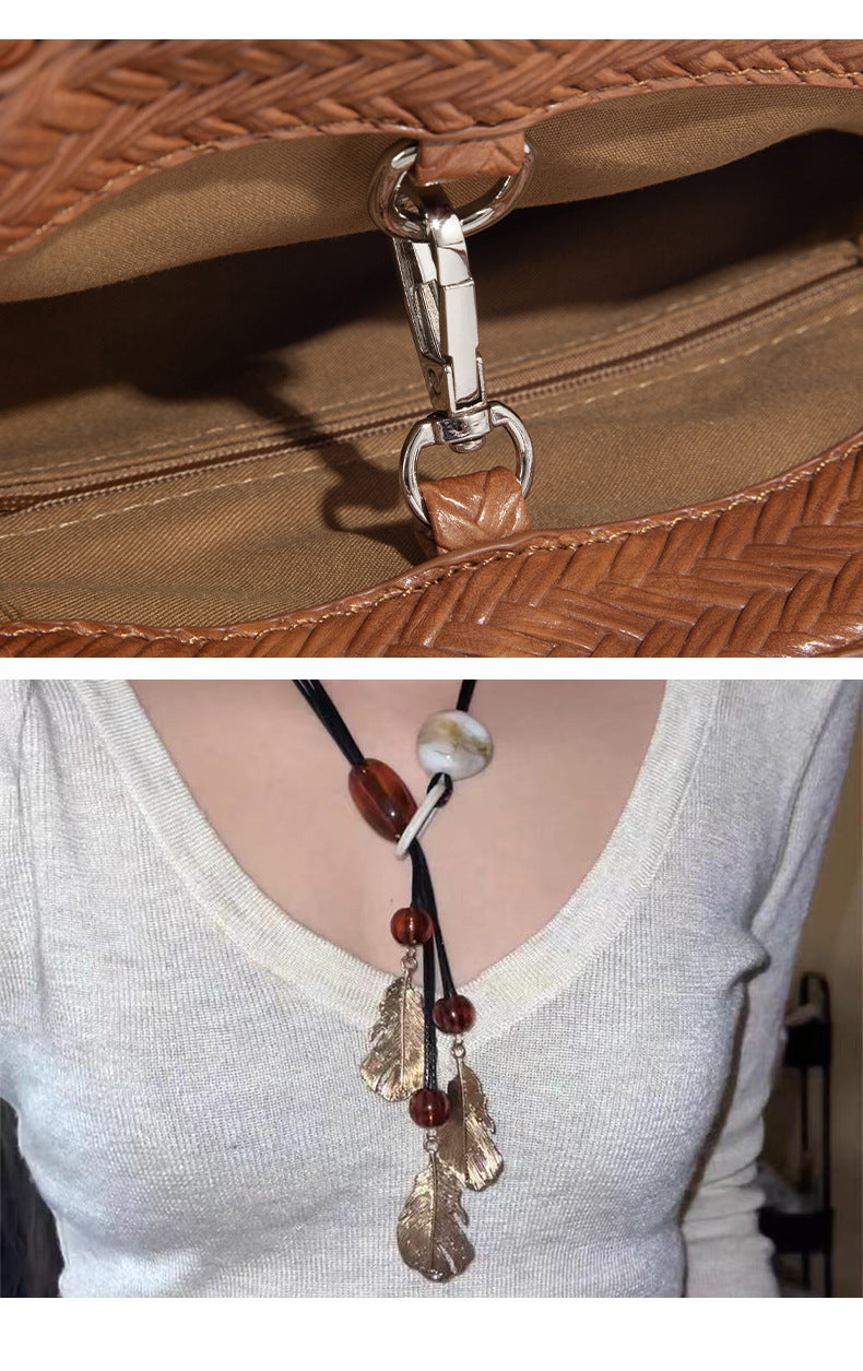 Structured woven herringbone tote bag with braided double shoulder handles in tan brown, shown with matching drawstring