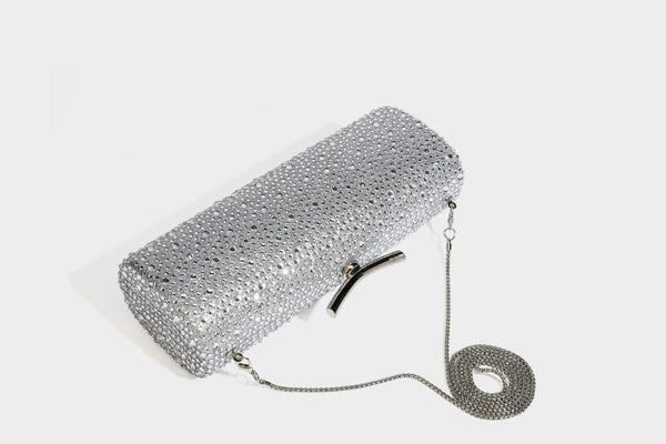 Structured rectangular hard-case clutch bag covered in all-over rhinestone crystal embellishment with curved kiss-lock top