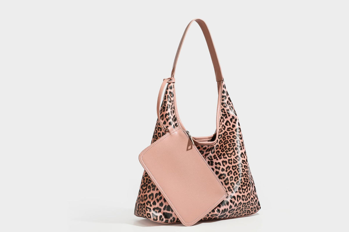 Glossy leopard-print slouchy shoulder bag with long strap and detachable tan zip pouch, detail view 35