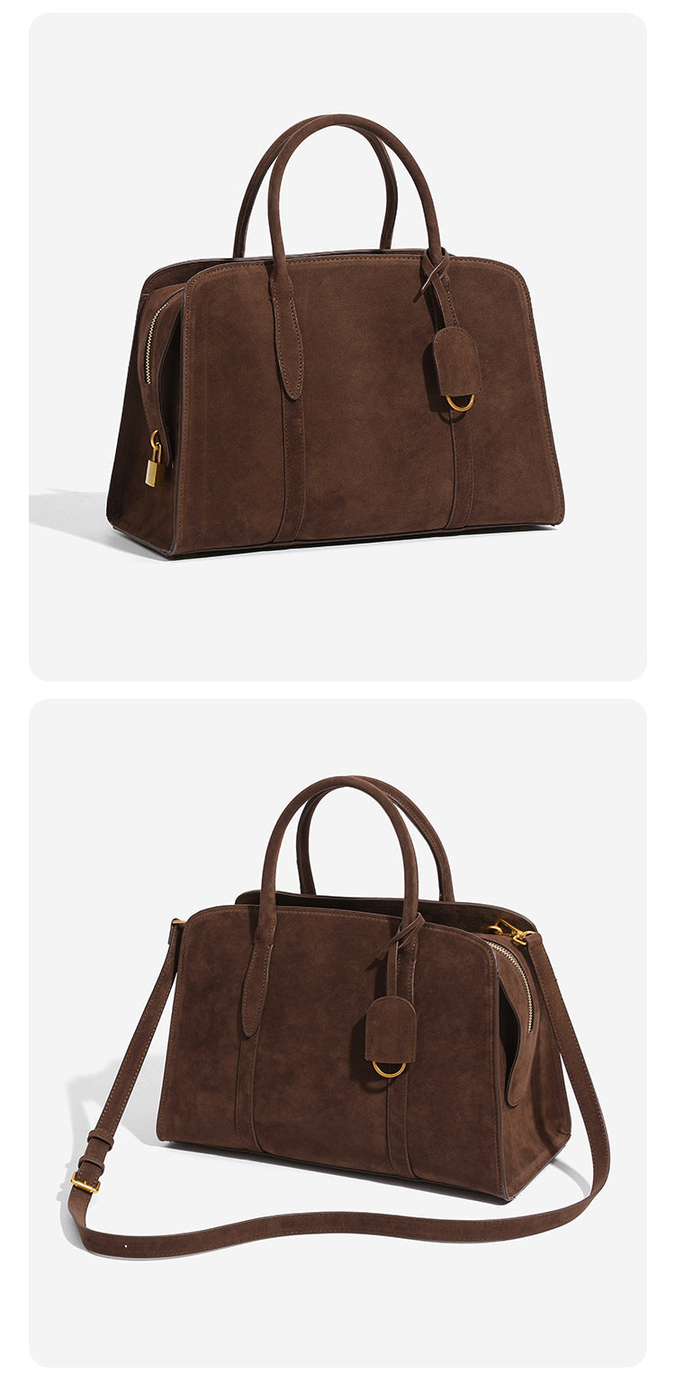 Structured retro Boston satchel bag with dual top handles, gold-tone ring hardware, and top zip closure, detail view 10