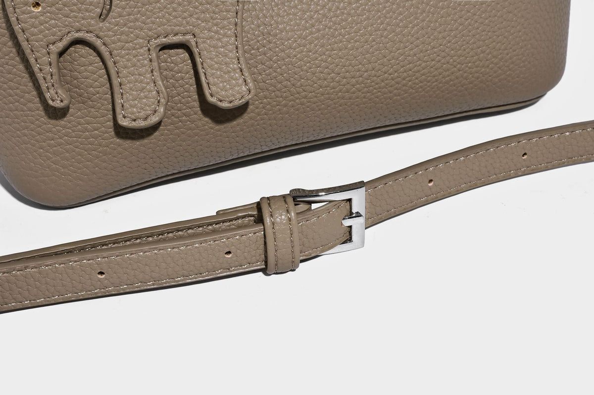 Compact pebbled bucket tote bag with elephant charm, twin top handles, and detachable crossbody strap, detail view 18