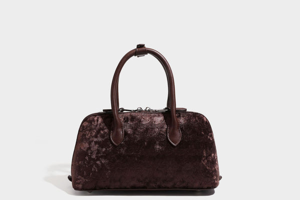 Small structured satchel bag in dark brown velvet-like textured finish with leather-look trim, silver-tone turn-lock bar
