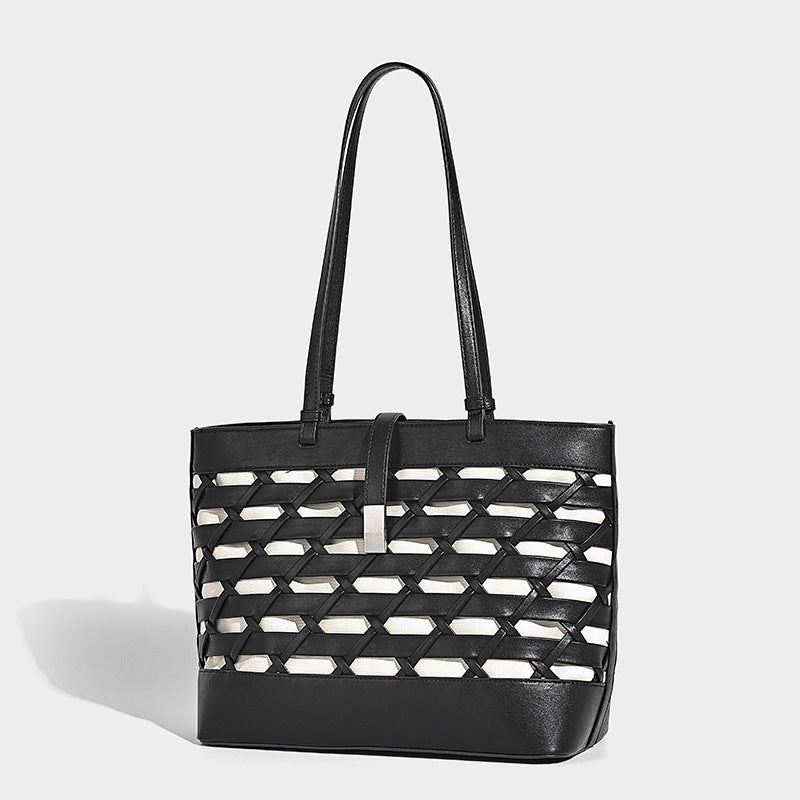 Structured woven lattice cutout tote bag with smooth leather-look trim, dual shoulder straps, and silver-tone hardware
