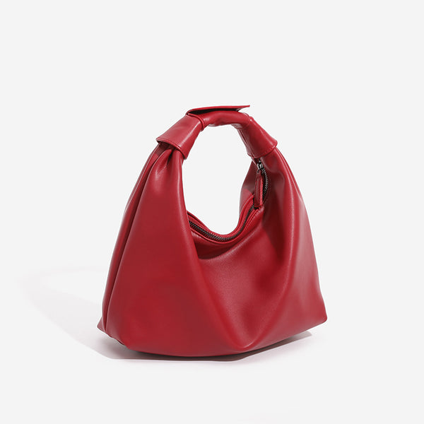 Slouchy leather-look hobo bag with knotted loop handle and top zipper closure, detail view 4