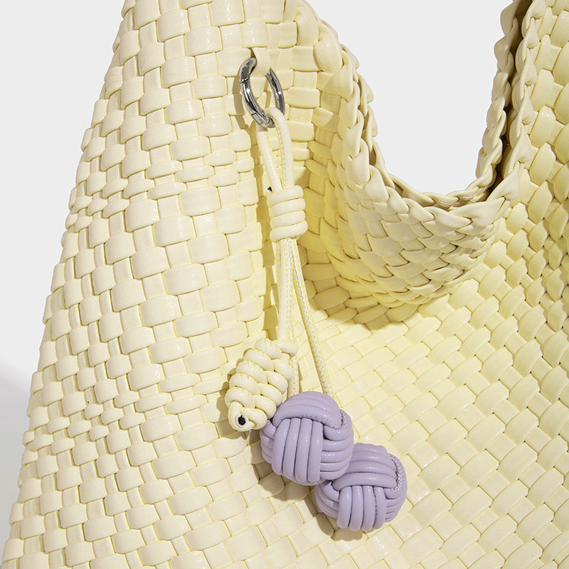 Soft hand-woven slouchy hobo tote bag with knotted tassel charm and single looped shoulder strap, detail view 31