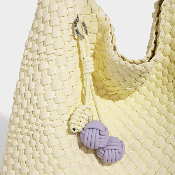 Soft hand-woven slouchy hobo tote bag with knotted tassel charm and single looped shoulder strap, detail view 31